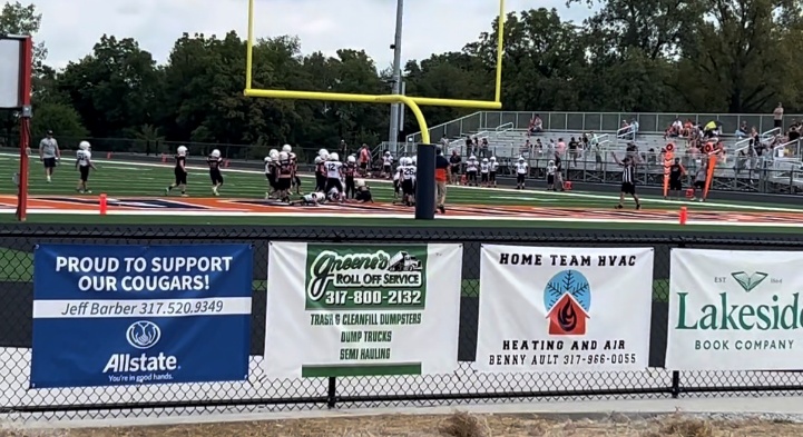 Home Team HVAC banner at football field