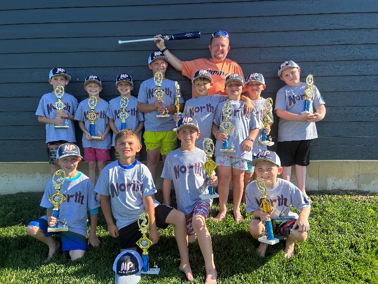 Youth baseball team with trophies
